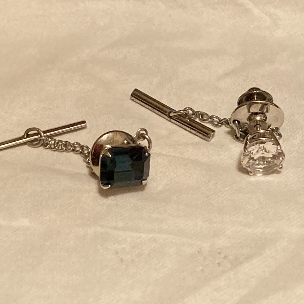 2 separate men’s tie tacks